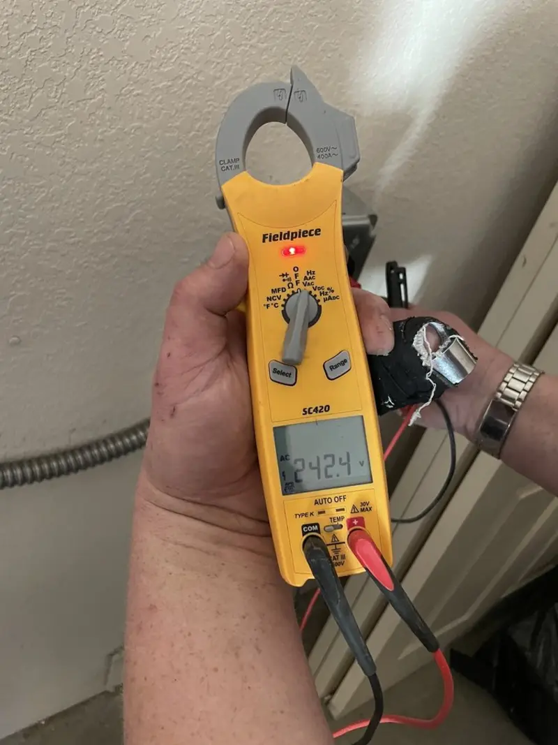 Voltage testing with clamp meter during Outlet Installation in Ambler